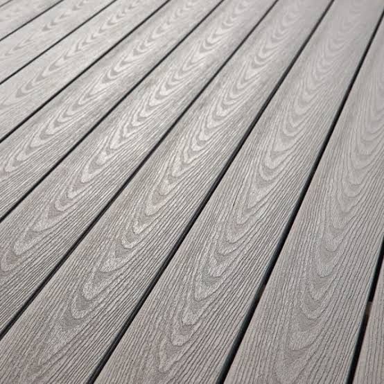 Gray composite decking with wood grain texture