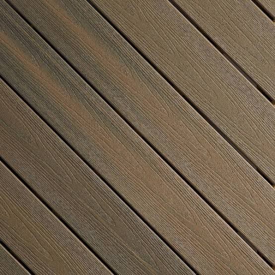 Close-up of Fiberon composite decking boards showing realistic wood grain and texture